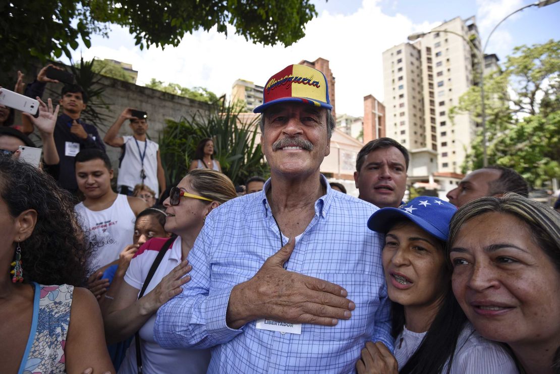 Fox greets voters at a Caracas polling station during the referendum Sunday. 
