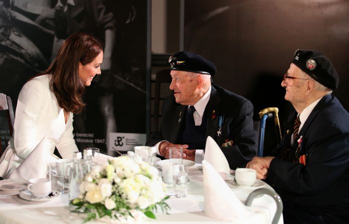 Kate speaks with a WWII veteran during a visit to the Warsaw Rising Museum on July 17, the first day of the British royal couple's official visit to Poland.