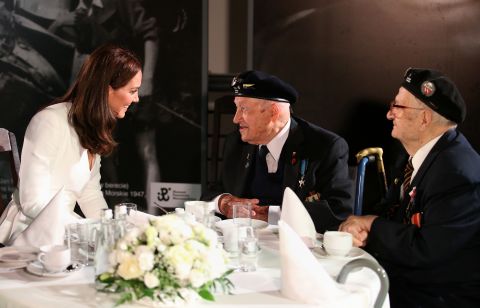 Kate speaks with a WWII veteran during a visit to the Warsaw Rising Museum on July 17, the first day of the British royal couple's official visit to Poland.