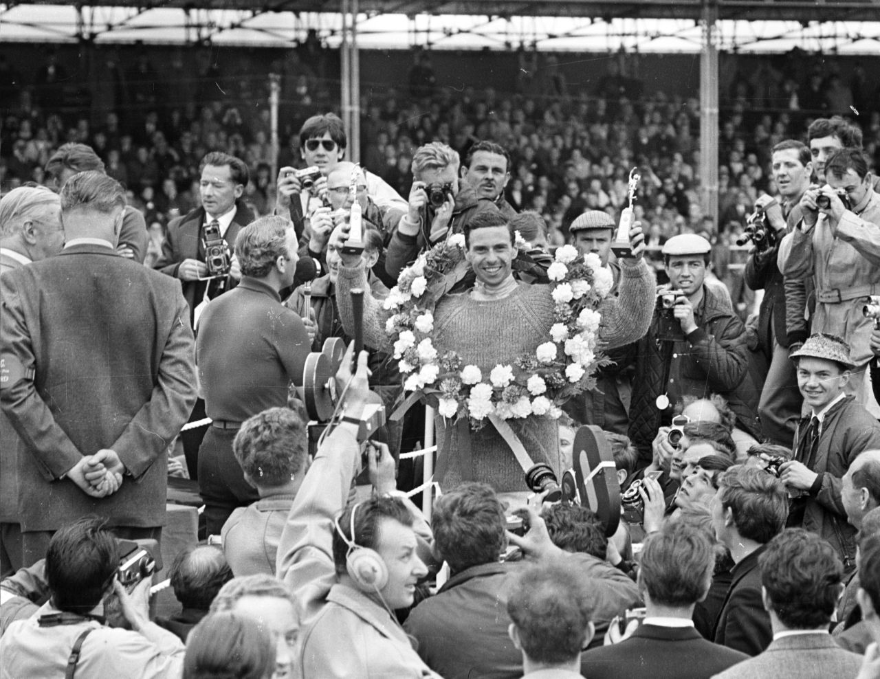 Briton Clark, pictured here celebrating his 1965 win at Silverstone, was one of F1's greatest drivers, winning the world title twice. 