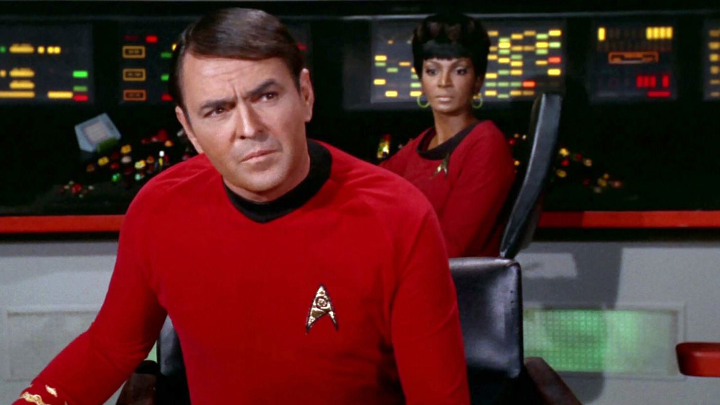 James Doohan as Montgomery "Scotty" Scott on the bridge with Nichelle Nichols as Uhura in the STAR TREK episode, "A Piece of the Action."  