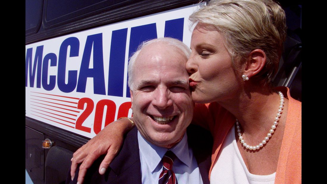 McCain gets a kiss from his wife as they kick off his campaign for the 2000 presidential election.