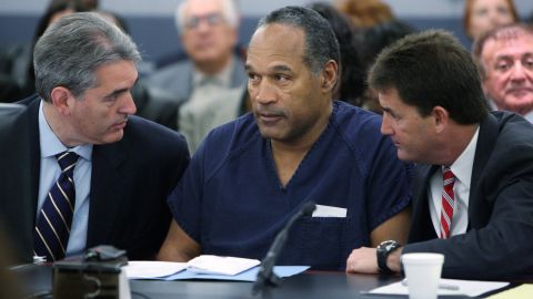O.J. Simpson, center, appears in court with attorneys Gabriel Grasso, left, and Yale Galanter before sentencing at the Clark County Regional Justice Center on December 5, 2008, in Las Vegas.