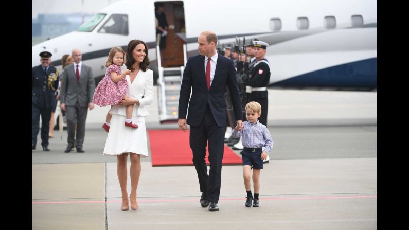 The royal couple disembarks with their children upon arrival on July 17, at the airport in Warsaw, Poland.