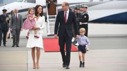 Britain's Prince William, Duke of Cambridge (R) and his wife Kate, Duchess of Cambridge (L) with their children Prince George and Princess Charlotte arrive at the airport in Warsaw, Poland, on July 17, 2017.The Duke and Duchess of Cambridge are on a first official visit to Poland. / AFP PHOTO / PAP / BARTLOMIEJ ZBOROWSKIBARTLOMIEJ ZBOROWSKI/AFP/Getty Images
