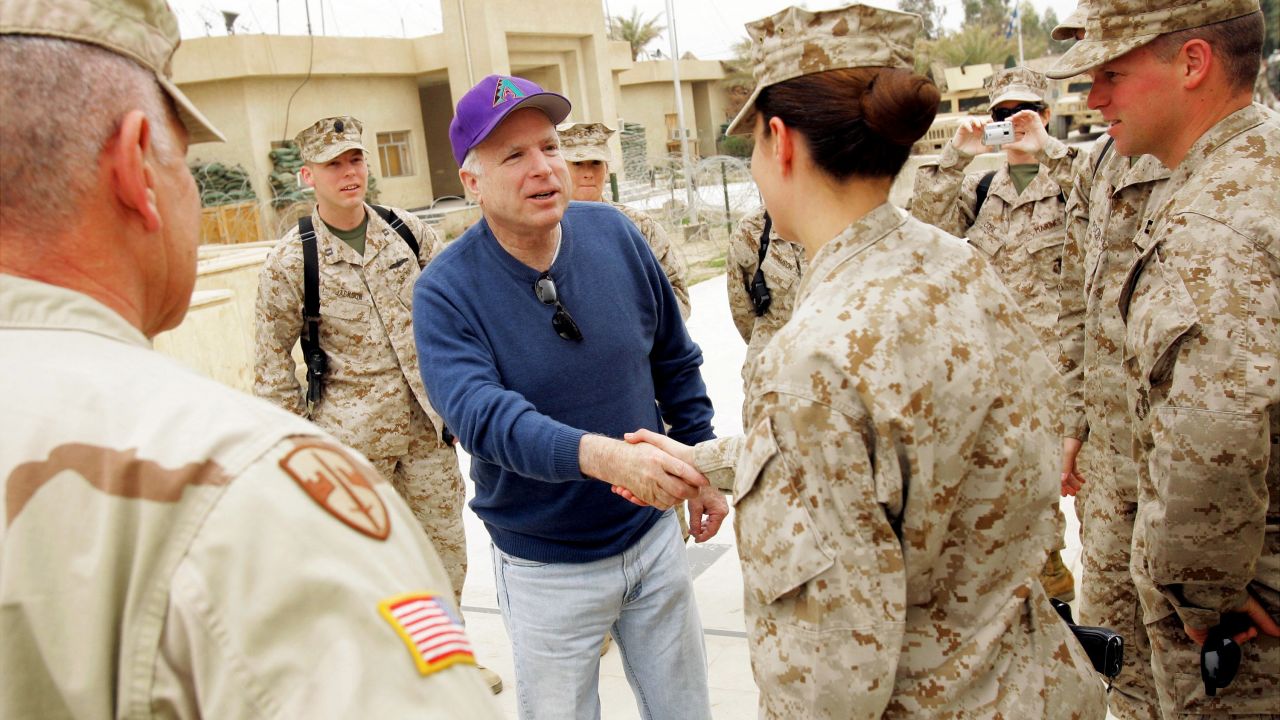 McCain talks with US Marines in Iraq as he and other senators stopped at Camp Falluja in 2005.