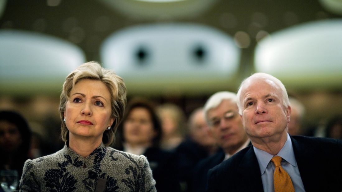 McCain and fellow US Sen. Hillary Clinton listen to President George W. Bush speak at the National Prayer Breakfast in 2007.