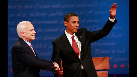 McCain shakes hands with US Sen. Barack Obama, the Democratic presidential nominee, before their first debate in 2008. Obama defeated McCain in the general election.
