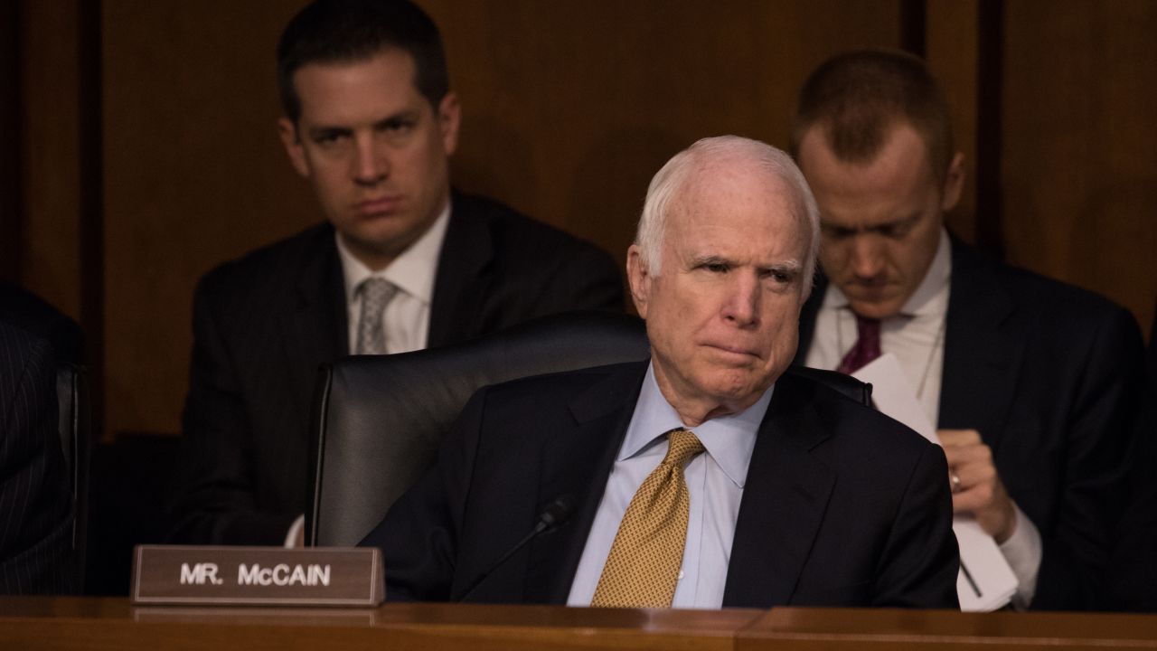 McCain listens as former FBI Director James Comey testifies to the Senate Intelligence Committee in June 2017.