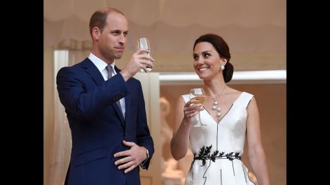 William and Kate make a toast during a Queen's birthday party in Poland.