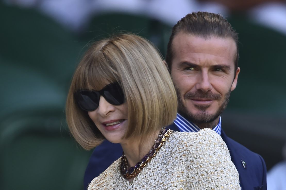 David Beckham and journalist and editor Anna Wintour arrive to take their seats in the Royal Box on Centre Court at Wimbledon.
