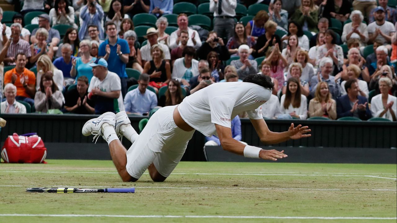 Brazil's Marcelo Melo falls to the ground with his shirt covering his face as he celebrates after he and his playing partner, Poland's Lukasz Kubot, defeated Austria's Oliver Marach and Croatia's Mate Pavic in the Men's Doubles final match on Saturday, July 15, at the Wimbledon Tennis Championships in London.