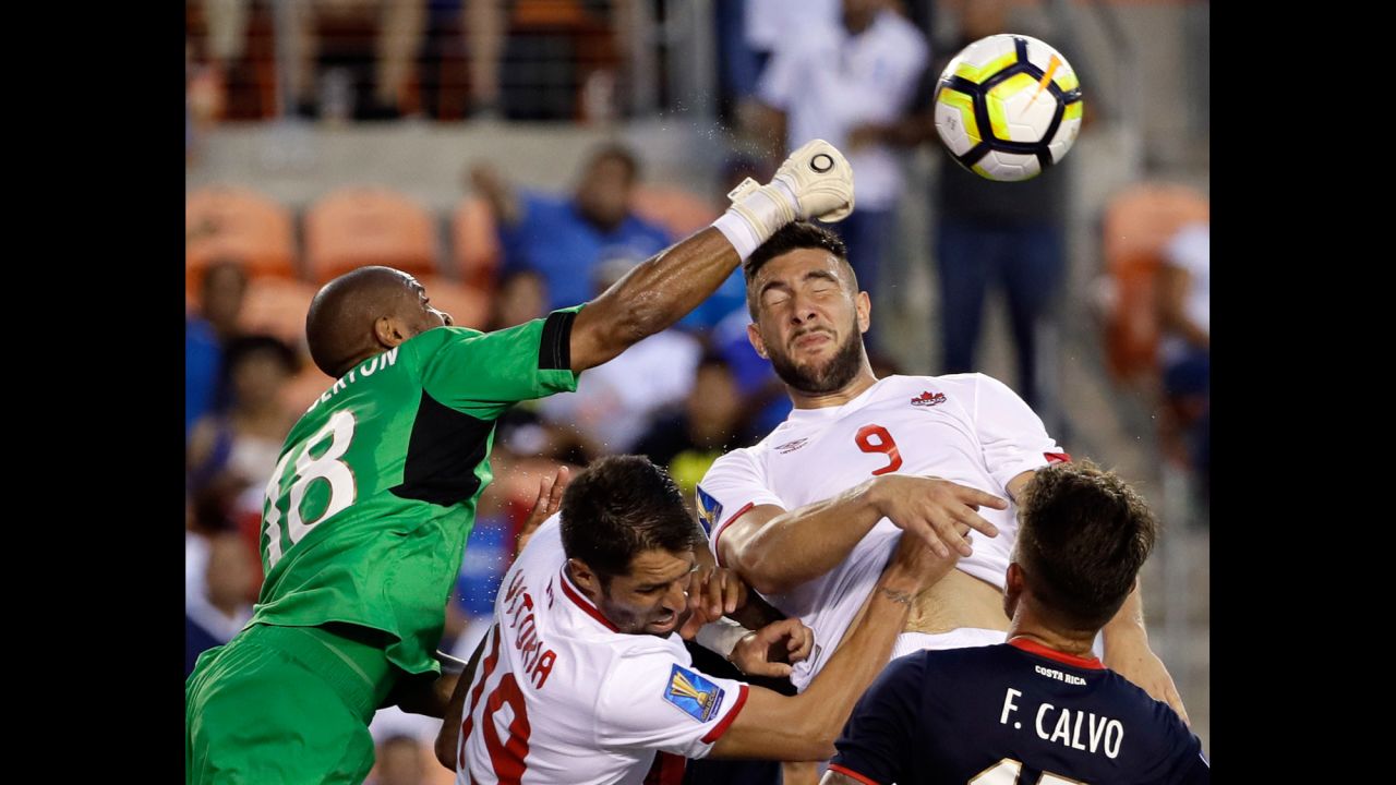 Costa Rica goalkeeper Patrick Pemberton, left, makes a save against Canada forward Lucas Cavallini, No. 9, in the second half of a <a href="https://www.mlssoccer.com/post/2017/07/11/costa-rica-1-canada-1-2017-concacaf-gold-cup-match-recap" target="_blank" target="_blank">CONCACAF Gold Cup soccer match</a> in Houston on Tuesday, July 11.