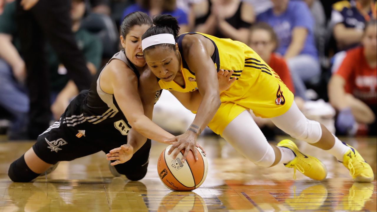 San Antonio Stars' Kelsey Plum, left, and Indiana Fever's Briann January dive for a loose ball during the second half of a WNBA basketball game on Wednesday, July 12, in Indianapolis. San Antonio defeated Indiana 79-72.