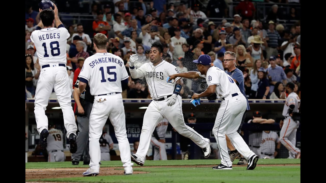 San Diego Padres' Hector Sanchez, second from right, is doused by teammates after hitting a two-run walk-off home run during the ninth inning against the San Francisco Giants on Saturday, July 15.