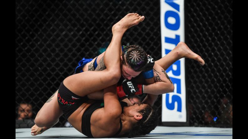 Joanne Calderwood, above, fights Cynthia Calvillo during their strawweight bout at UFC Fight Night Glasgow on Sunday, July 16.