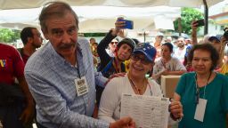Former Mexican president Vicente Fox (L), named by the Venezuelan opposition as an observer to the opposition-organized vote to measure public support for Venezuelan President Nicolas Maduro's plan to rewrite the constitution, is pictured at a polling station in Caracas on July 16, 2017.
Authorities have refused to greenlight the vote that has been presented as an act of civil disobedience and supporters of Maduro are boycotting it. Protests against Maduro since April 1 have brought thousands to the streets demanding elections, but has also left 95 people dead, according to an official toll.  / AFP PHOTO / Ronaldo SCHEMIDT        (Photo credit should read RONALDO SCHEMIDT/AFP/Getty Images)