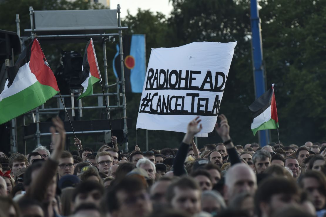 Protesters against Radiohead's planned concert in Tel Aviv at a show in Glasgow, Scotland.