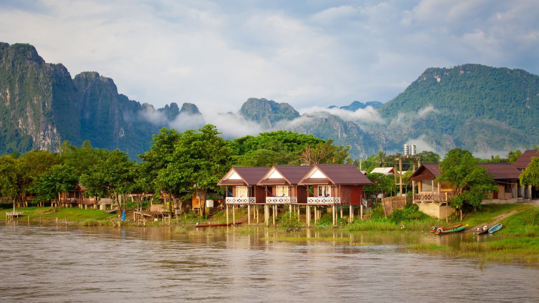 <strong>Vang Vieng:</strong> Outside the capital, Laos draws travelers to its low-key heritage villages, such as Vang Vieng, in Central Laos. The area is known for its limestone mountains, caves, and turquoise lagoons. 