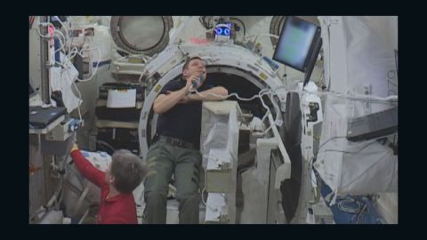 Astronauts Peggy Whitson and Jack Fischer float in space with "Int-Ball," July 2017.