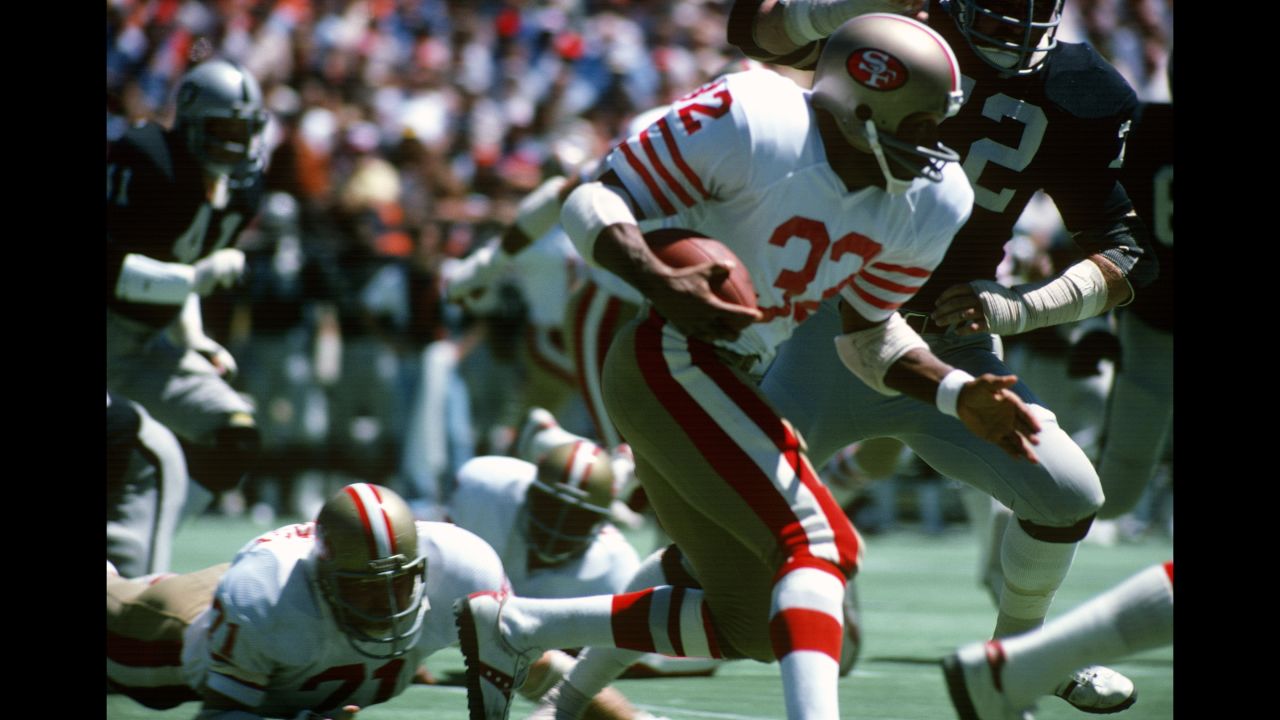 As a running back for the San Francisco 49ers, Simpson carries the ball against the Oakland Raiders during a preseason game circa 1978.