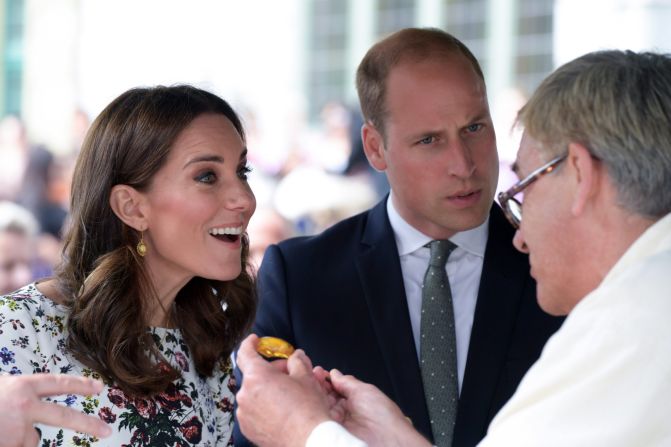 Kate and William are shown a piece of amber by a local craftsman during a visit on July 18, to the Gdansk central market in Poland.