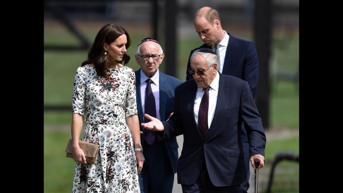 Former Nazi concentration camp prisoners Manfred Goldberg, second from left, and Zigi Shipper speak with the royal couple during their visit to Stutthof, a World War II Nazi concentration camp in the village of Sztutowo, Poland.