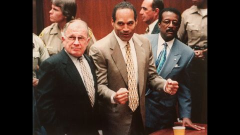 Simpson cheers with his attorneys F. Lee Bailey, left, and Johnnie Cochan Jr. on October 3, 1995, after being found not guilty of killing Nicole Brown Simpson and Ronald Goldman. Though cleared of criminal charges, a civil jury later slapped the former football star with a $33 million wrongful death judgment, and attorneys for the Goldman family have doggedly pursued his assets.