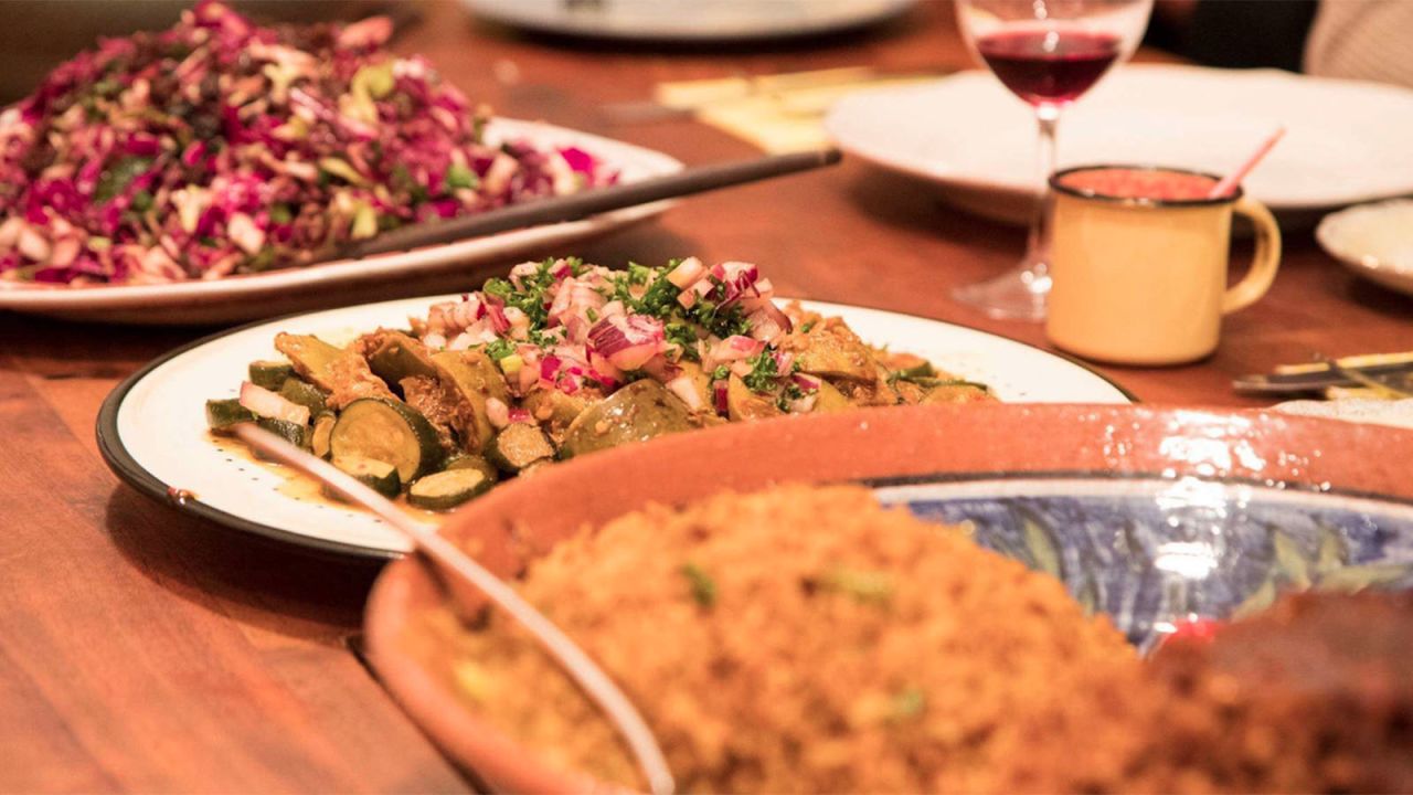 Eclectic meals are served around an 18-seater table at the Yeoville Dinner Club.