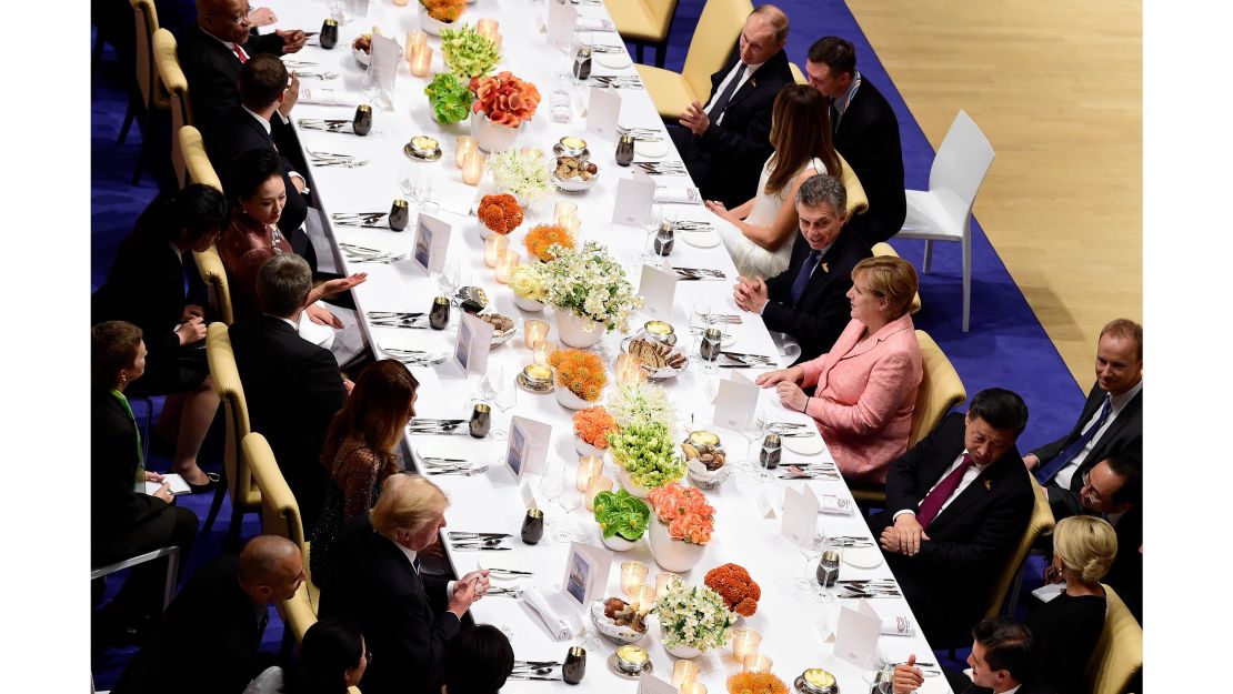 Russian President Vladimir Putin seen top right, next to US First Lady Melania Trump at a banquet during the G20 Summit in Hamburg.