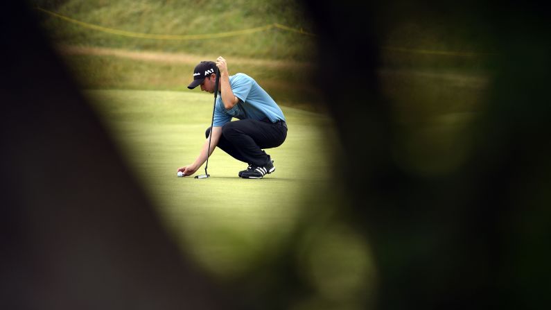 Canada's Austin Connelly places his ball on the fourth green. Royal Birkdale opened in 1889 and is one of the game's most celebrated links courses -- with two nines fanning into the sandhills of Southport, overlooking the Irish Sea.