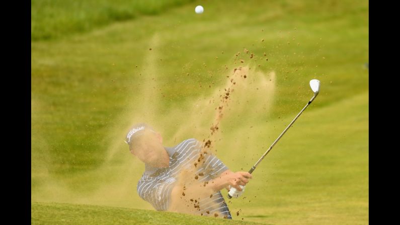 Bill Haas of the United States tied for ninth at last year's Open. He is pictured here hitting from a bunker during practice.
