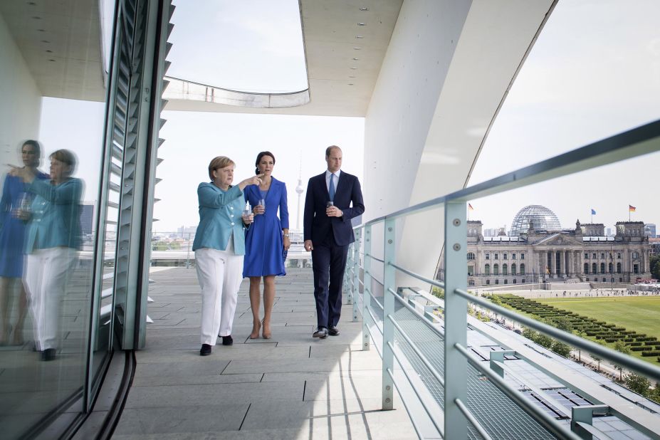 German Chancellor Angela Merkel shows William and Kate a view from the Federal Chancellery on July 19, in Berlin, in this In this handout photo from the German government's press office.