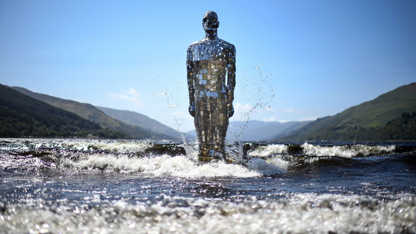 <strong>Loch Earn, Scotland:</strong> St Fillans locals know when it's summertime because Rob Mulholland's Mirror Man statue returns to the waters of Loch Earn for its fair-weather residency. When winter rolls around, the three-meter-tall sculpture returns to storage. <br />