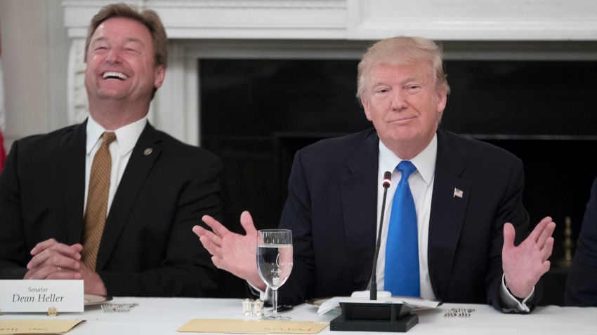 WASHINGTON, DC - JULY 19: (AFP OUT) US President Donald Trump (R) delivers remarks on health care and Republicans' inability thus far to replace or repeal the Affordable Care Act, beside Sen. Dean Heller (R-NV) (L) during a lunch with members of Congress in the State Dining Room of the White House on July 19, 2017 in Washington, DC. (Photo by Michael Reynolds - Pool/Getty Images)