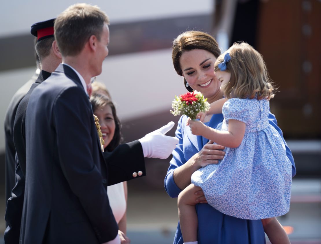 Britain's littlest ambassador received flowers matching her mom's bouquet. 