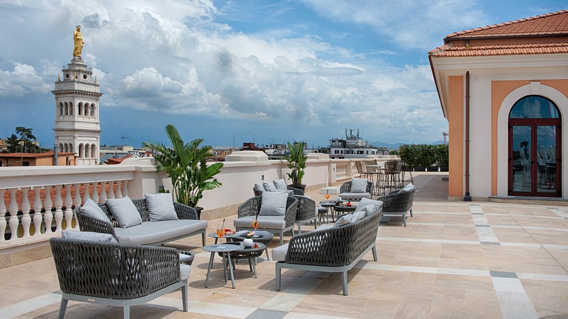 The top floor bar at Palazzo Cinquecento offers views of Rome's skyline as well as historic Roman ruins.