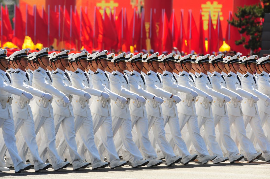 Chinese People's Liberation Army (PLA) naval officers march pass Tiananmen Square during the National Day parade in Beijing on October 1, 2009.  