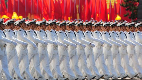 Chinese People's Liberation Army (PLA) naval officers march pass Tiananmen Square during the National Day parade in Beijing on October 1, 2009.  