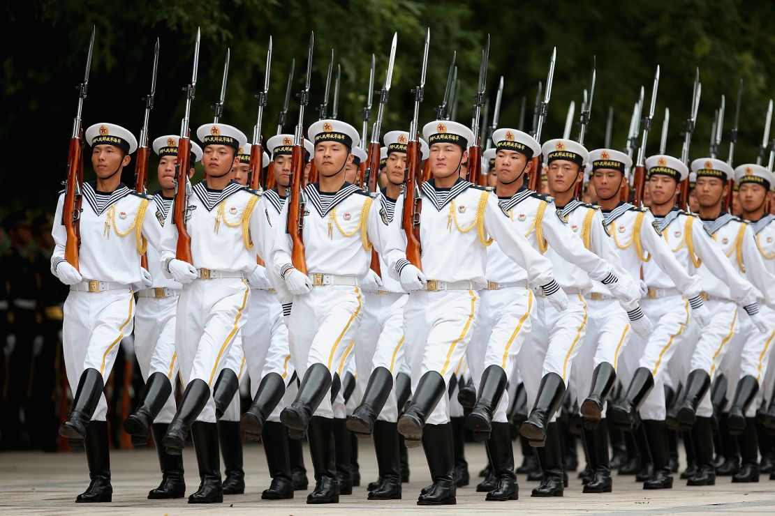 Chinese People's Liberation Army navy soldiers of a guard of honor rehearse before a welcoming outside the Great Hall of People.