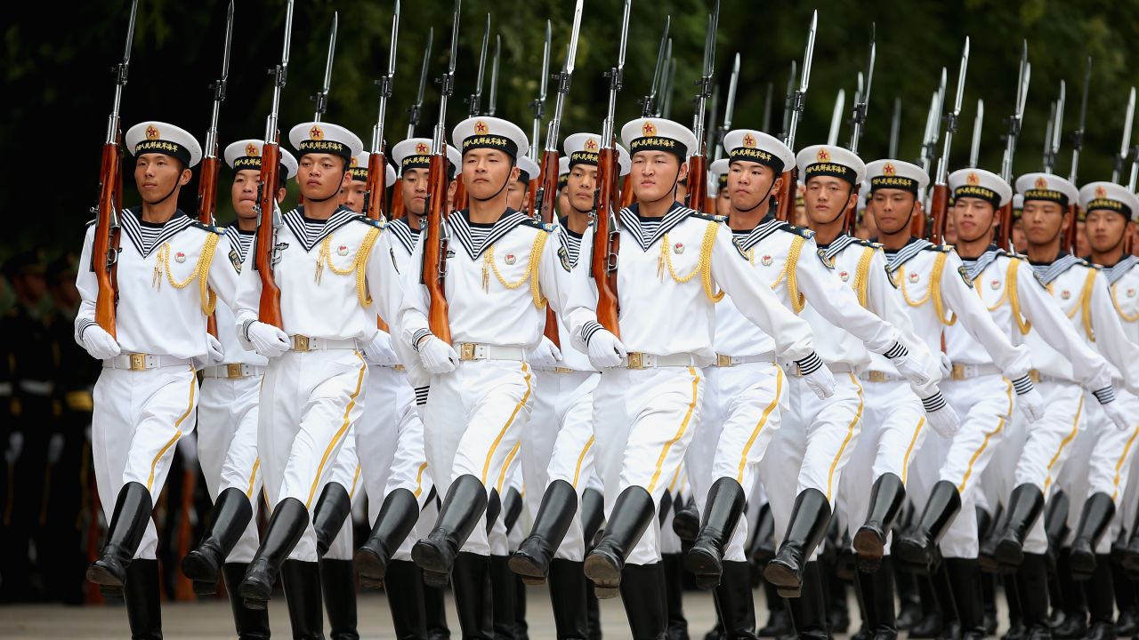 Chinese People's Liberation Army navy soldiers of a guard of honor rehearse before a welcoming outside the Great Hall of People.