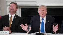 President Donald Trump (R) delivers remarks on health care and Republicans' inability thus far to replace or repeal the Affordable Care Act, beside Sen. Dean Heller (R-NV) (L) during a lunch with members of Congress in the State Dining Room of the White House on July 19, 2017 in Washington, DC. (Photo by Michael Reynolds - Pool/Getty Images)