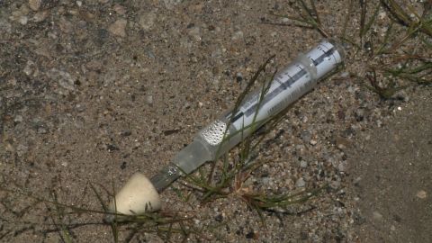 A Narcan syringe lays on the ground outside a child's home in Manchester, New Hampshire.  