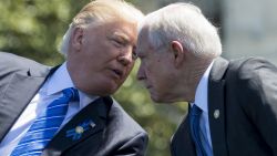 US President Donald Trump speaks with Attorney General Jeff Sessions (R) during the 36th Annual National Peace Officers Memorial Service at the US Capitol in Washington, DC, May 15, 2017. / AFP PHOTO / SAUL LOEB        (Photo credit should read SAUL LOEB/AFP/Getty Images)