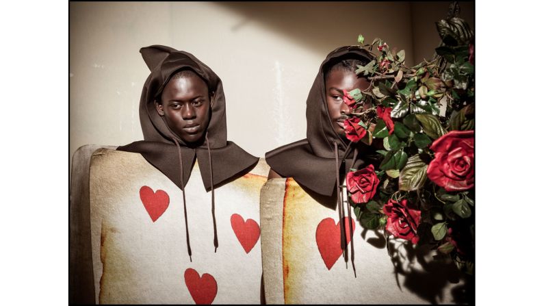 Models Alpha Dia and King Owusu as Hearts Playing Cards Gardners. 