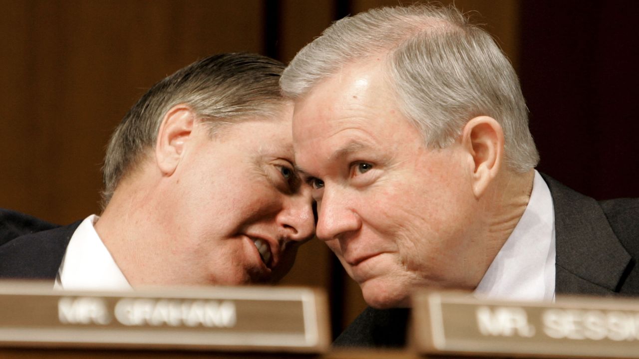 Sessions and Sen. Lindsey Graham, R-South Carolina, confer during a Judiciary Committee confirmation hearing for Alberto R. Gonzales in January 2005. President George W. Bush nominated Gonzales to be  attorney general.