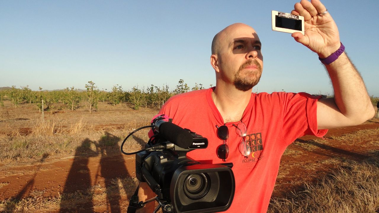 Filmmaker David Makepeace observing a total solar eclipse in Australia in November 2012.