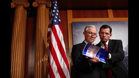 Sessions and Sen. John Barrasso, R-Wyoming, look at a copy of the 2013 budget during a news conference on Capitol Hill in February 2012. Obama's 2013 proposed budget was criticized by Republicans.