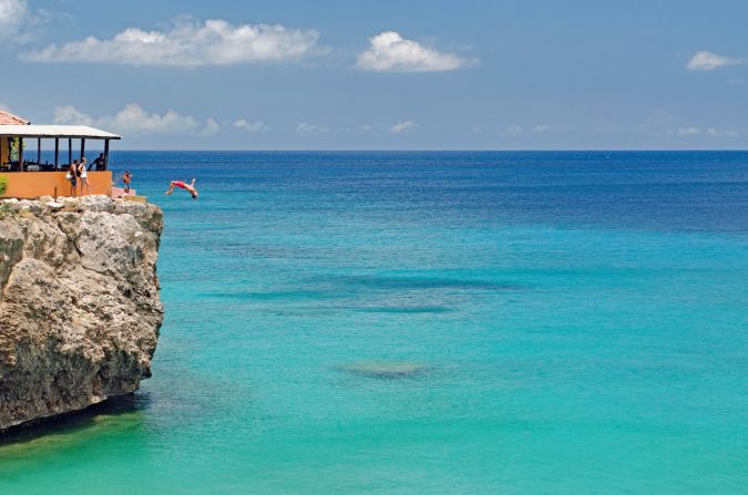 <strong>Take a leap!</strong> Jumping off the 40-foot cliff at Playa Forti is a Cura?ao bucket list item -- or you can just watch from a distance. 