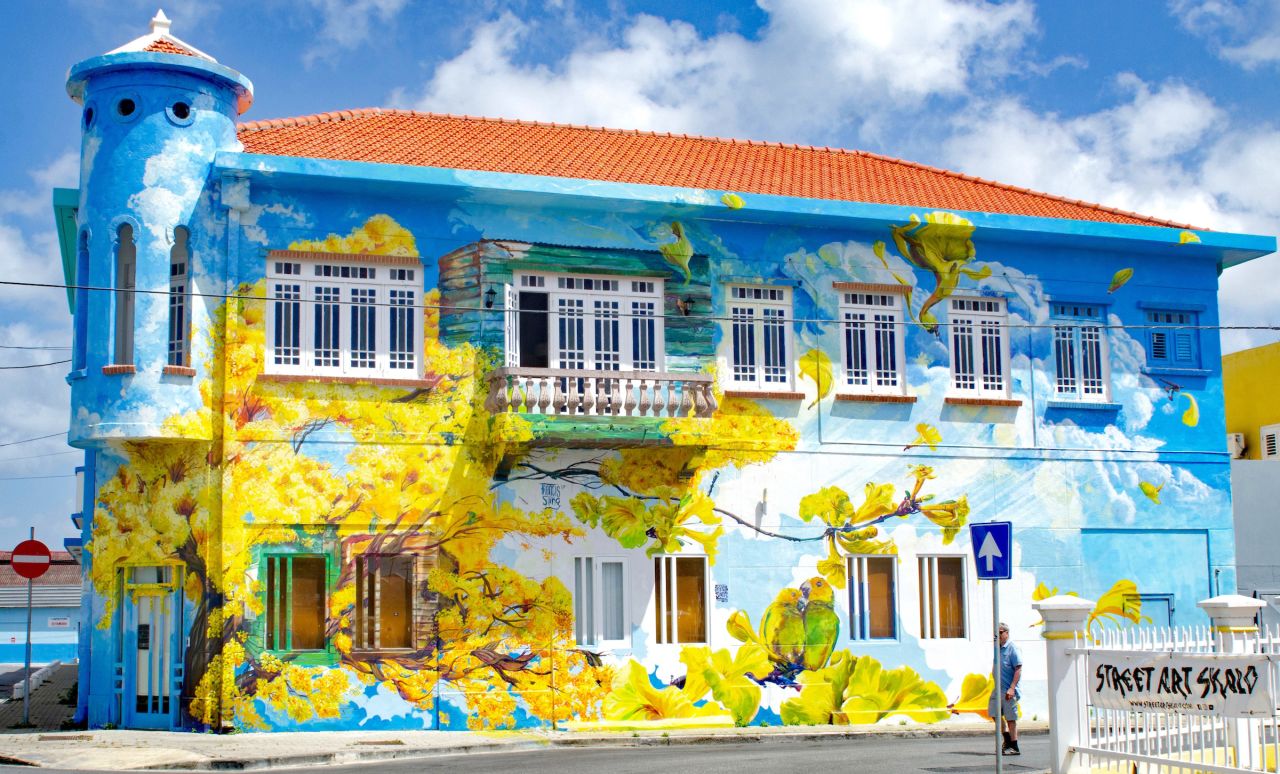 A colorful mural covers a building in the Scharloo neighborhood of Willemstad.